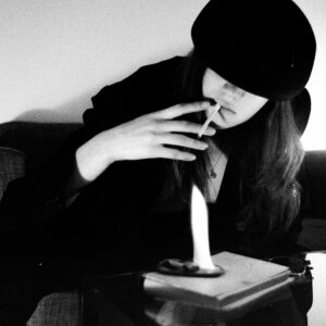 Lighting a cigarrete with fire on book